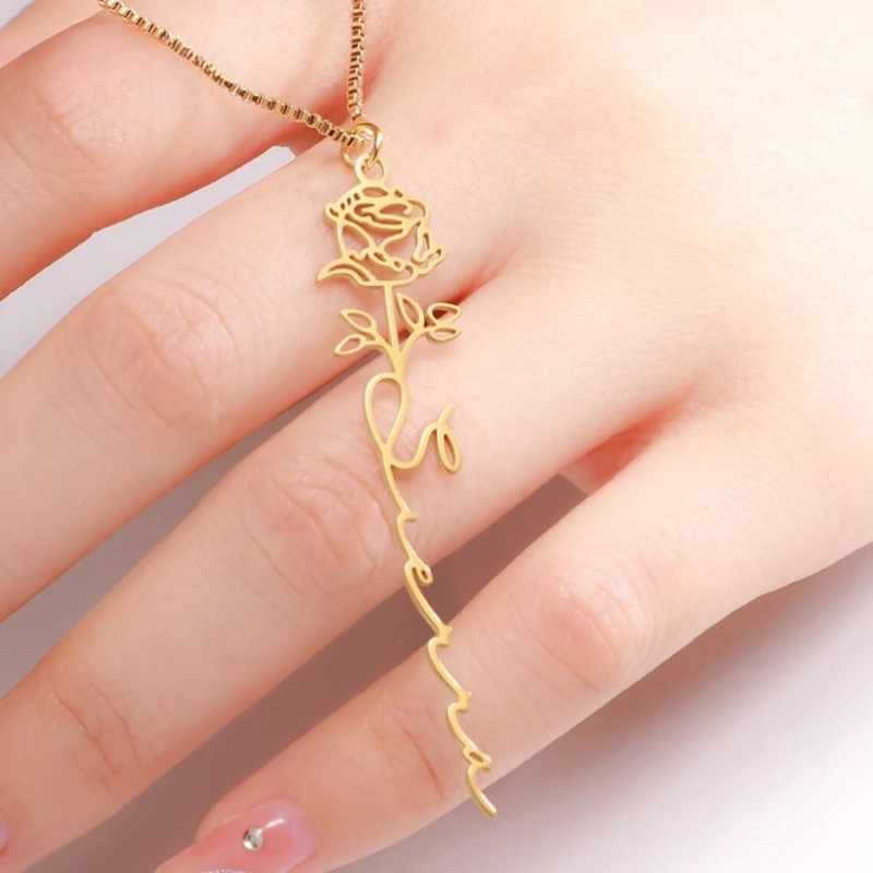 Birth Flower Name Necklace across models hand.